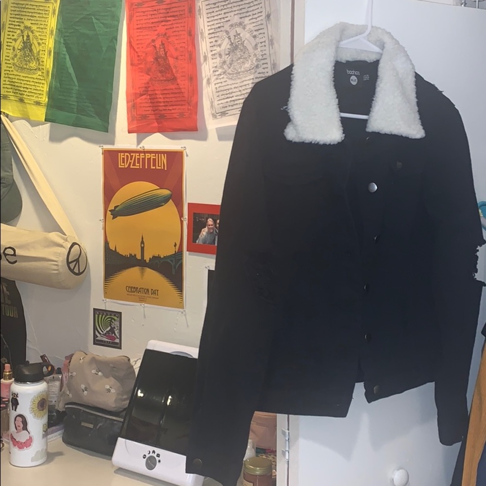black denim jacket with a white fur collar